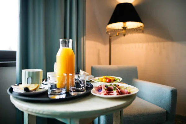 Food on a table in a hotel room. — Stock Photo, Image
