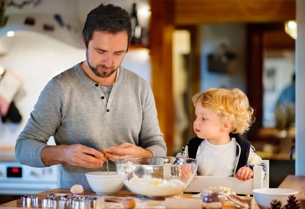 Young family making cookies at home. — Stock Photo, Image