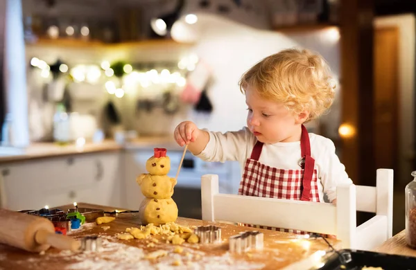 Toddler boy making gingerbread cookies at home. — Stock Photo, Image