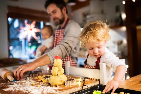 Young family making cookies at home. — Stock Photo, Image