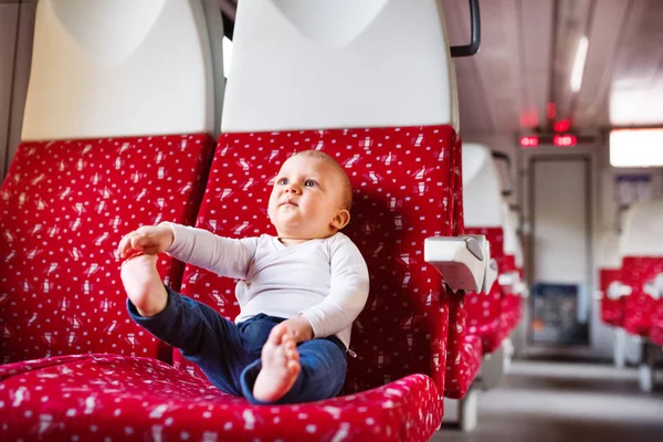 Cute baby boy travelling by train. — Stock Photo, Image