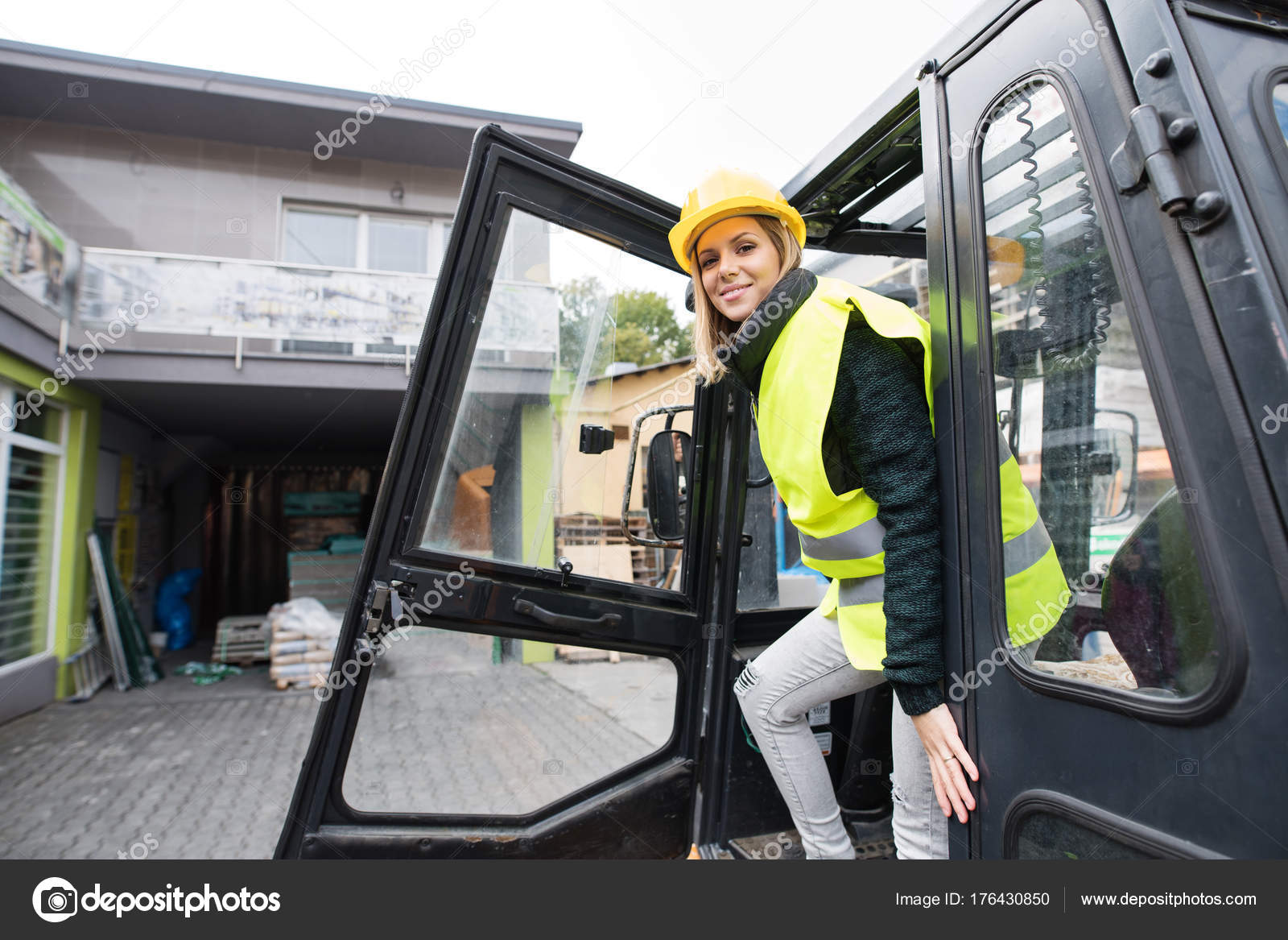 Woman Forklift Truck Driver In An Industrial Area Stock Photo C Halfpoint 176430850