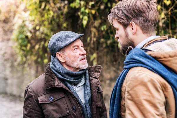 Senior father and his young son on a walk. — Stock Photo, Image