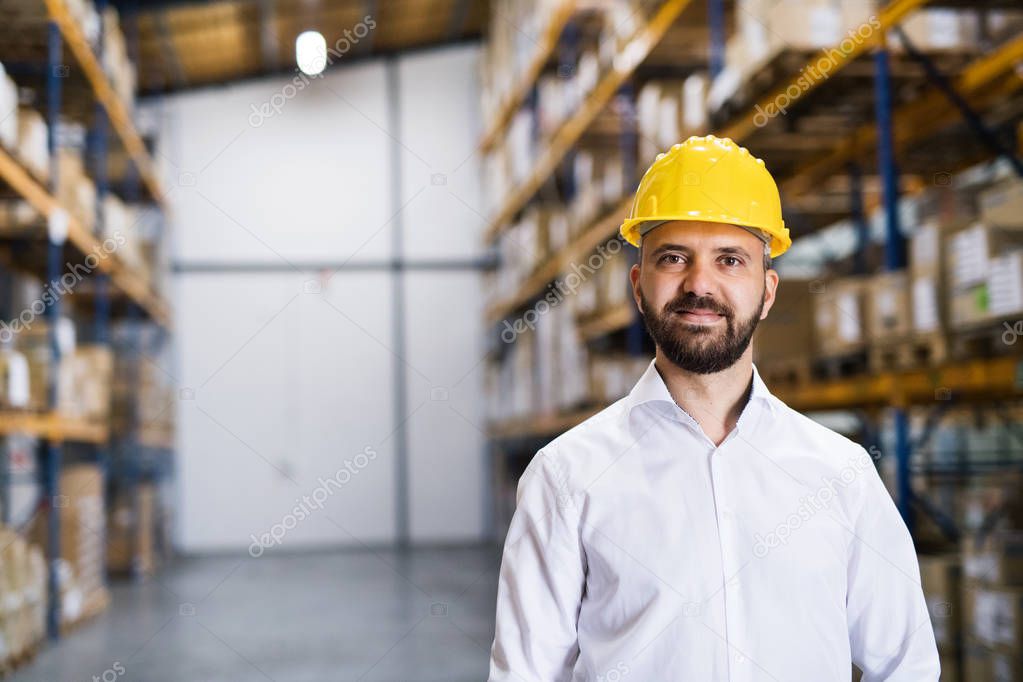 Portrait of a male warehouse worker or supervisor.