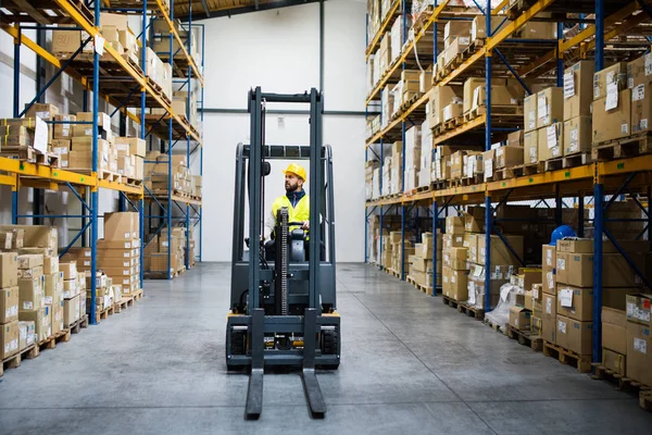 Warehouse man worker with forklift. — Stock Photo, Image