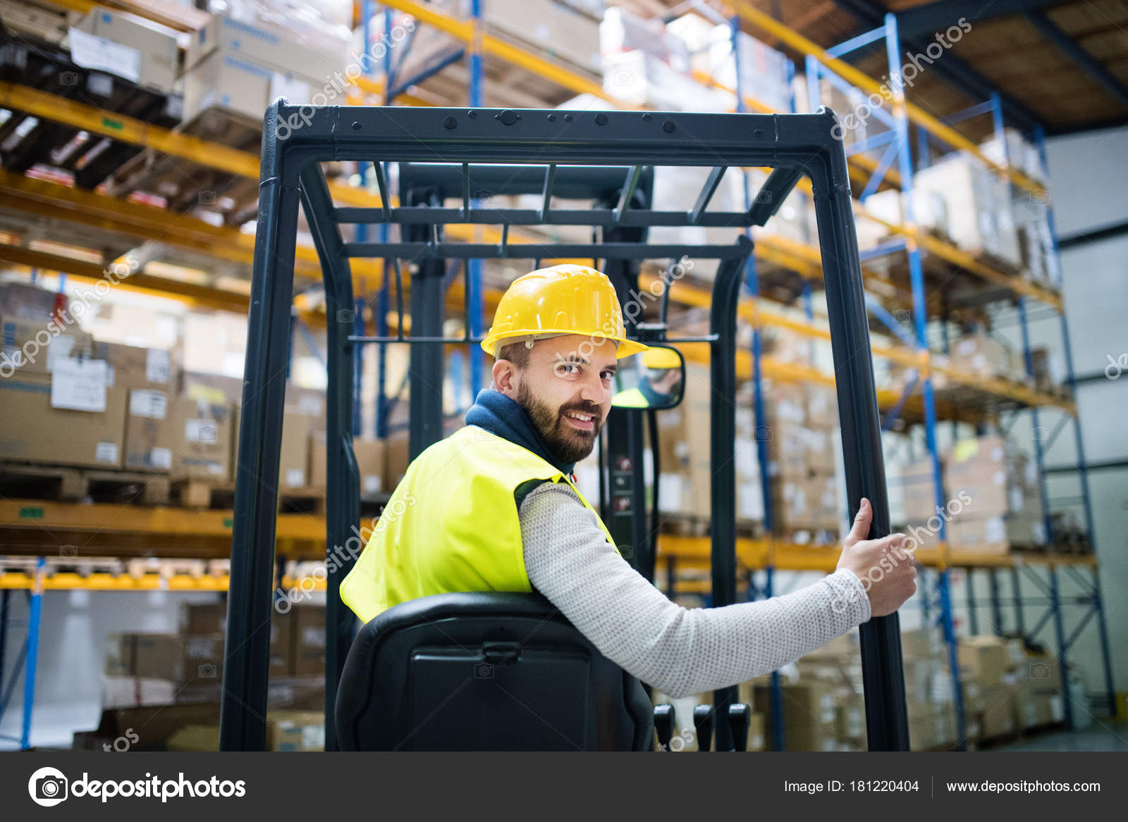 Warehouse man worker with forklift. Stock Photo by ©halfpoint 181220404