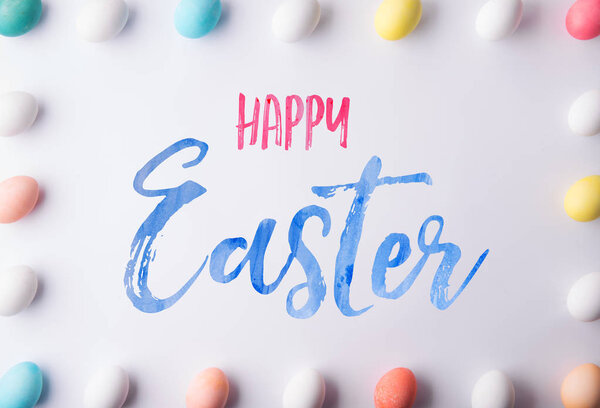 Happy Easter flat lay on a white background.