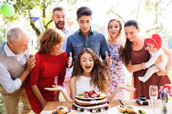 Family celebration or a garden party outside in the backyard.