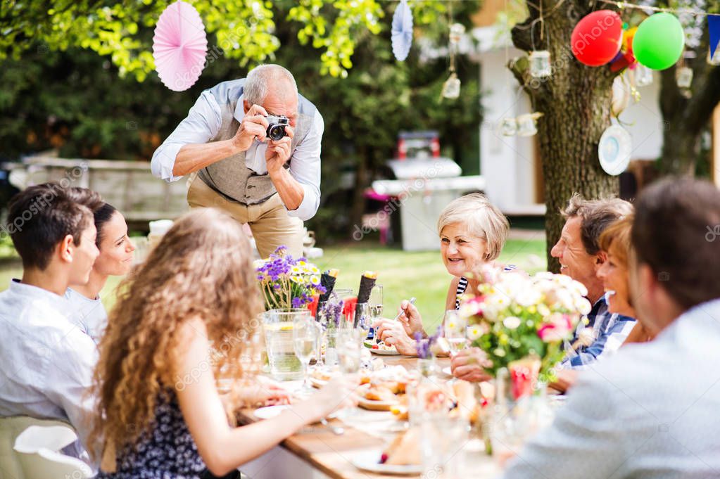 Family celebration or a garden party outside in the backyard.