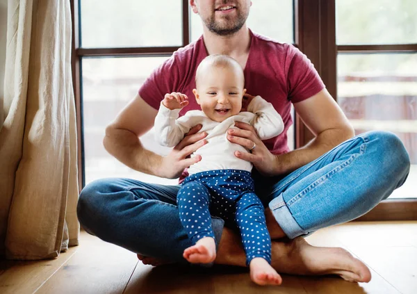 Father with a baby girl at home. — Stock Photo, Image