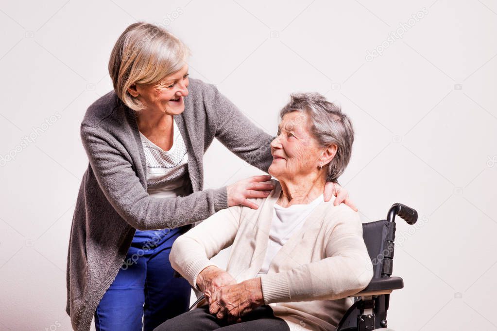Studio portrait of a senior women in wheelchair.