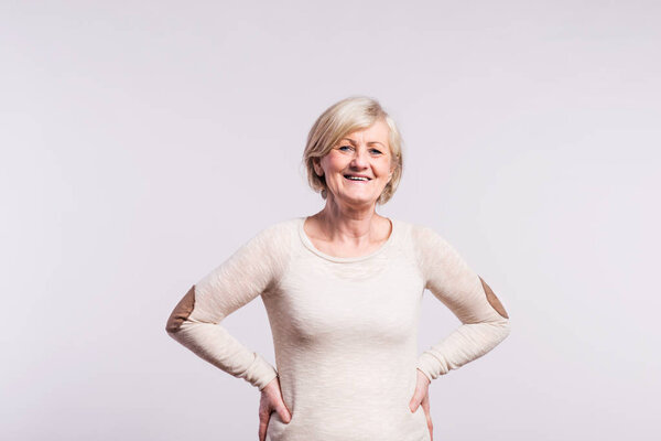 Portrait of a happy senior woman in studio.