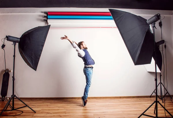 Portrait of a young hipster man in a studio. Copy space. — Stock Photo, Image