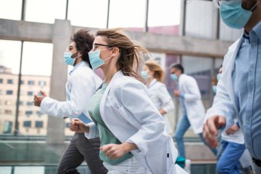 Yüz maskeli bir grup doktor, Corona virüsü konsepti..