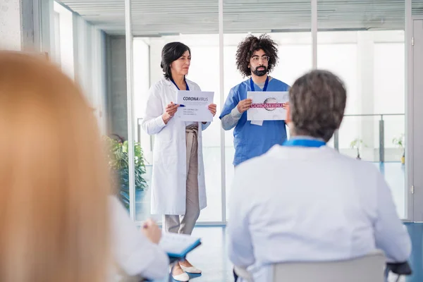 Group of doctors talking about corona virus on conference. — Stock Photo, Image