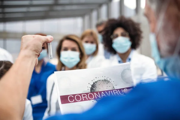 Group of doctors talking about corona virus on conference. — Stock Photo, Image