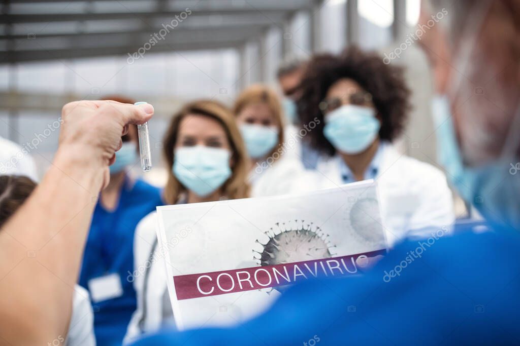 Group of doctors talking about corona virus on conference.