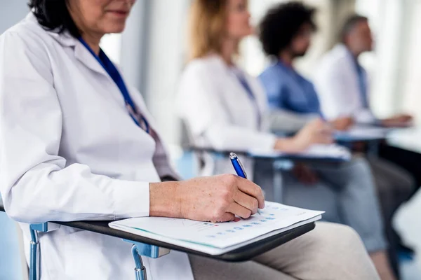 Group of doctors on conference, medical team sitting and listening. — Stock Photo, Image