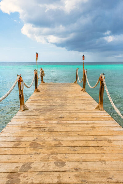 Walking along the shoreline and we came across a very peaceful scene with this dock that seems to extend into paradise.