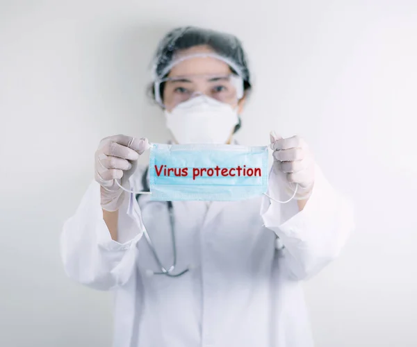 Doctor holding Mask Virus protection germs and flu coronavirus