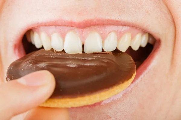 Young lady eating candy