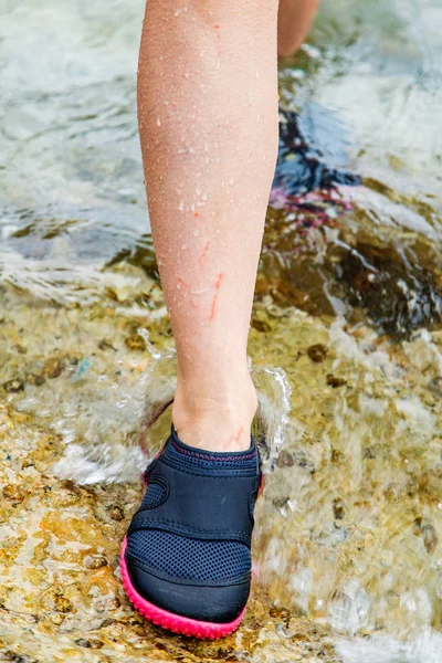 Woman in water shoe — Stock Photo, Image