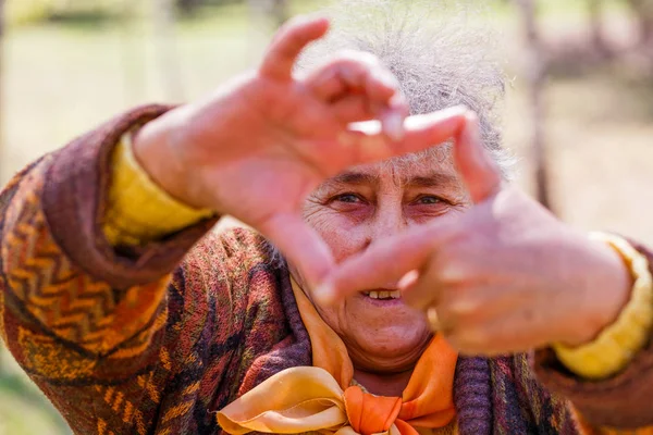 Portrait of smiling elderly woman — Stock Photo, Image