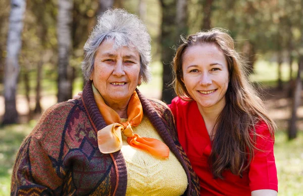 Happy elderly woman with her daughter — Stock Photo, Image