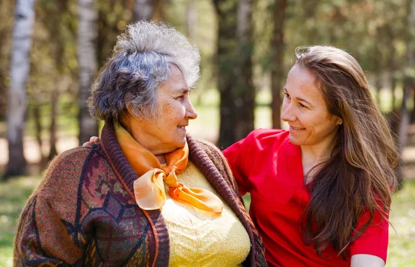 Happy elderly woman with her daughter — Stock Photo, Image