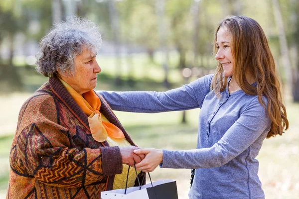 Happy elderly woman with her daughter — Stock Photo, Image