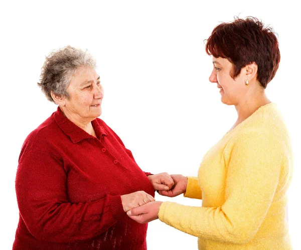 Elderly woman and young caregiver — Stock Photo, Image