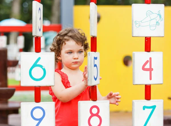 Little girl playing on the playground — Stock Photo, Image