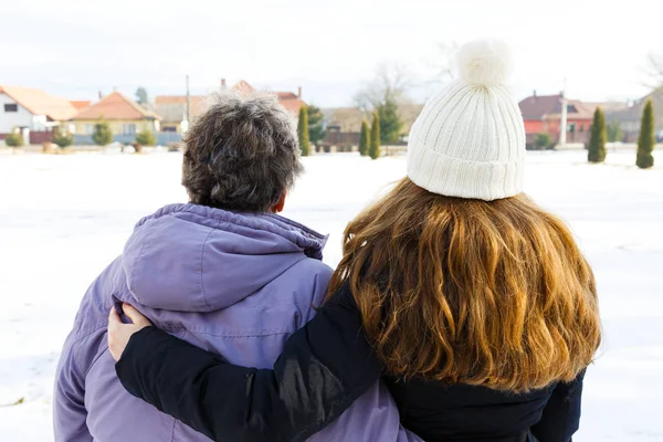 Elderly woman and young caregiver — Stock Photo, Image