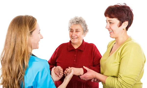 Donna anziana con badante e il giovane medico — Foto Stock