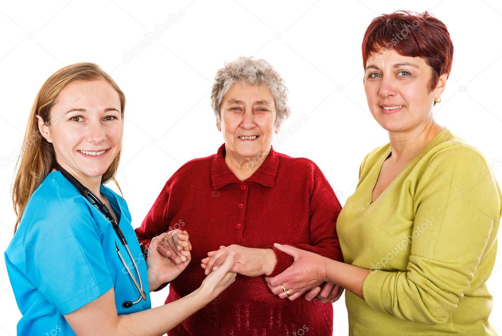 Elderly woman with carer and the young doctor 