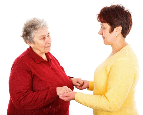 Elderly woman and young caregiver — Stock Photo, Image