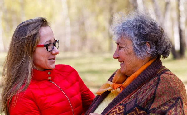 Happy elderly woman with her daughter — Stock Photo, Image