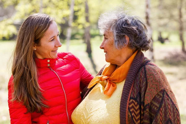 Happy elderly woman with her daughter — Stock Photo, Image