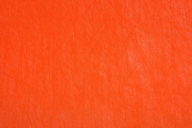 Çizikler ile turuncu parlak plastik doku. Turuncu arka plan.