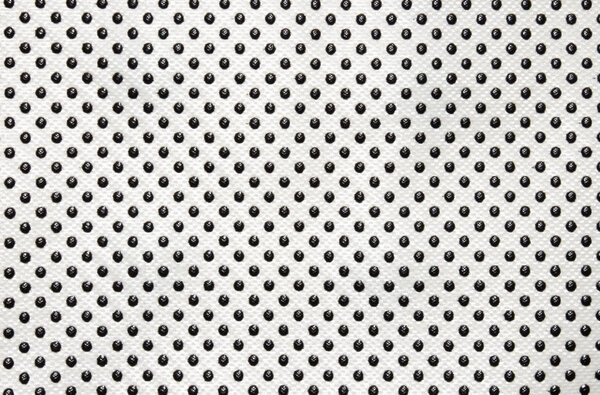 White fabric texture in black dot.White fabric background with black polka dots.