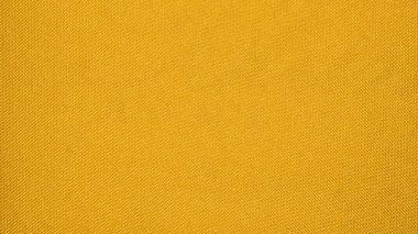 Sarı bağlayıcı kumaş dokusu. Sarı arkaplan. Sarı kumaş. Desenli yüzeyi olan bir arkaplan.