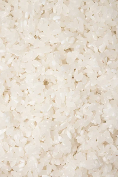 Round-grain crumbly rice.Rice groats.Background of rice grains.The texture of the rice.