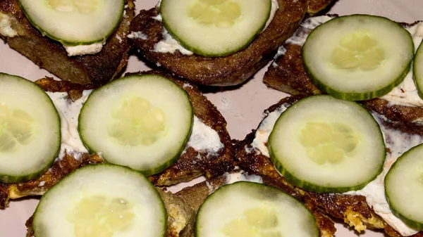 Sandwiches with fresh cucumbers.The bread is toasted.Bread with egg and cucumbers.