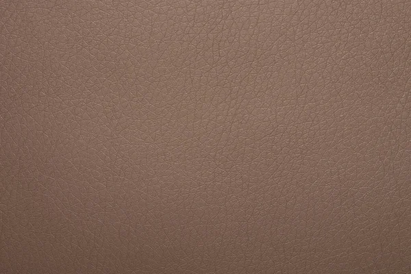 Brown chocolate skin texture. The dark brown leather background.