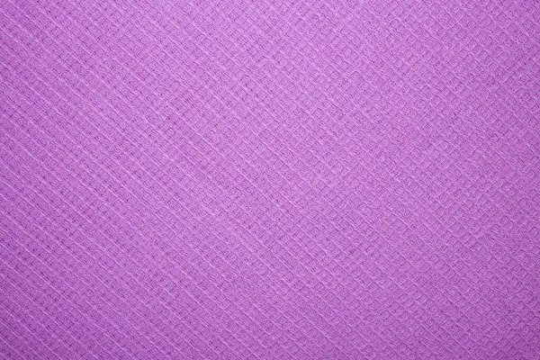 Purple uniform texture of the fabric.Purple textured background.