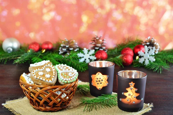 Christmas background, greeting card with burning candle and gingerbread cookies — Stock Photo, Image