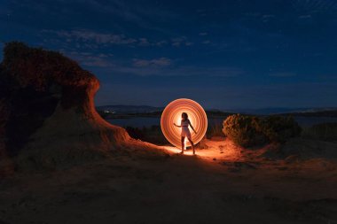 Beautiful girl in front of a mystic light circle