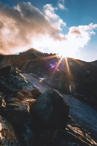 Impressive sun rays on the top of a mountain