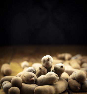 Delicious tamarinds on a wooden board