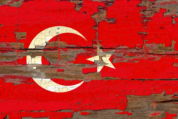 Old plumbed Turkey flag on wood.